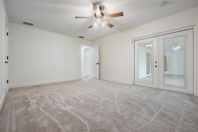 unfurnished bedroom with access to exterior, carpet, visible vents, and french doors