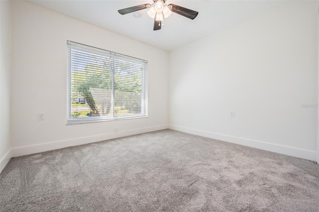 unfurnished room featuring a ceiling fan, baseboards, and carpet floors