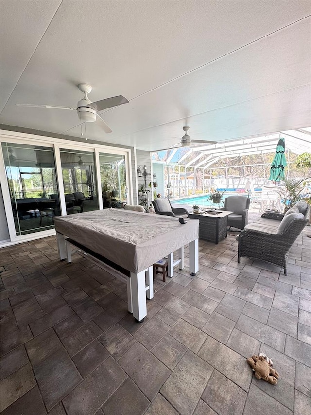 view of patio / terrace featuring an outdoor pool, an outdoor hangout area, a lanai, and ceiling fan