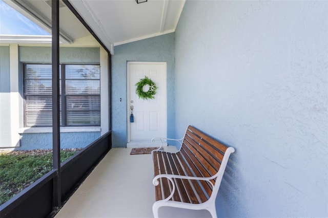 property entrance featuring stucco siding