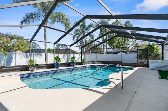 view of swimming pool with a patio area, a fenced backyard, a fenced in pool, and a lanai