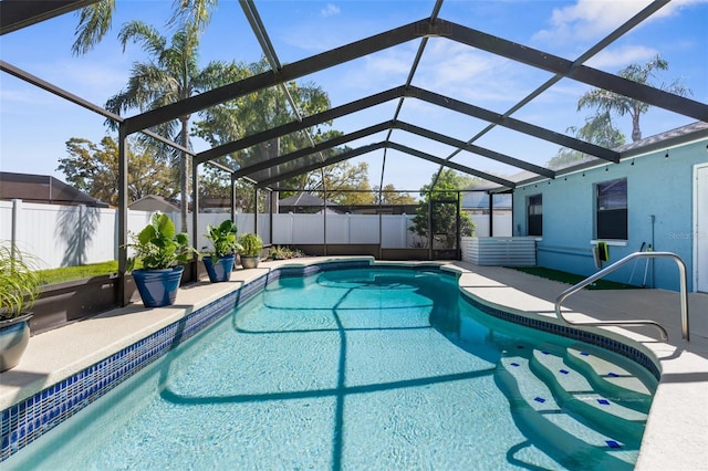 view of pool featuring a fenced in pool, a patio, a fenced backyard, and glass enclosure