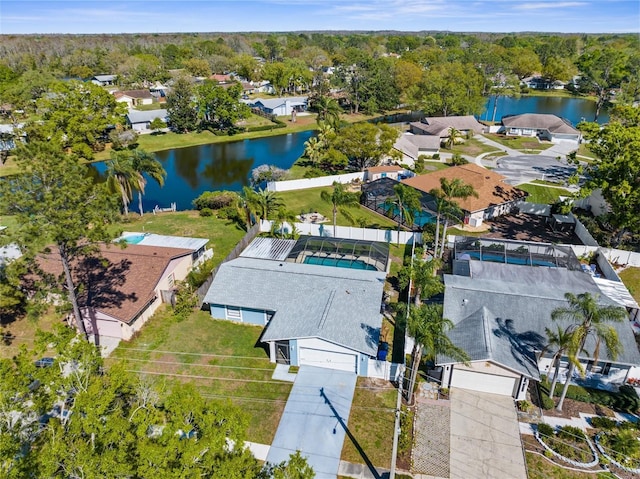 birds eye view of property featuring a residential view and a water view