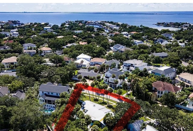 birds eye view of property featuring a residential view and a water view