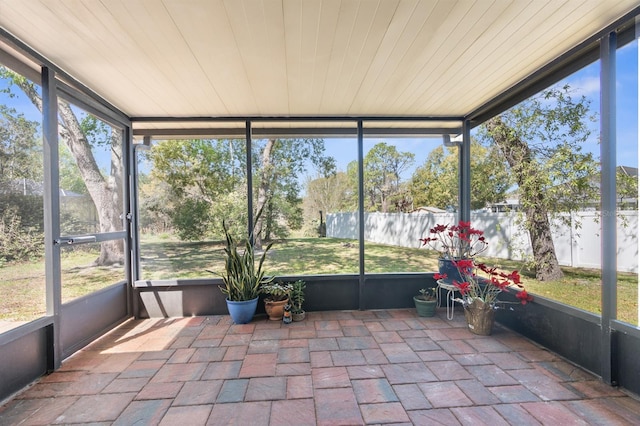 unfurnished sunroom featuring a healthy amount of sunlight