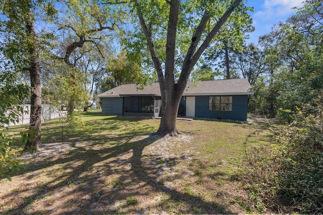 view of yard with a sunroom