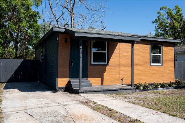 view of front of house with entry steps and fence