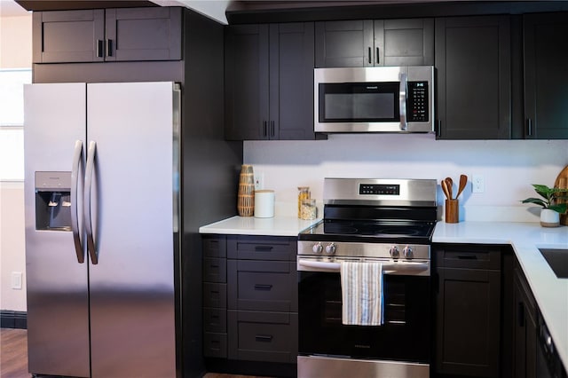 kitchen with stainless steel appliances and light countertops