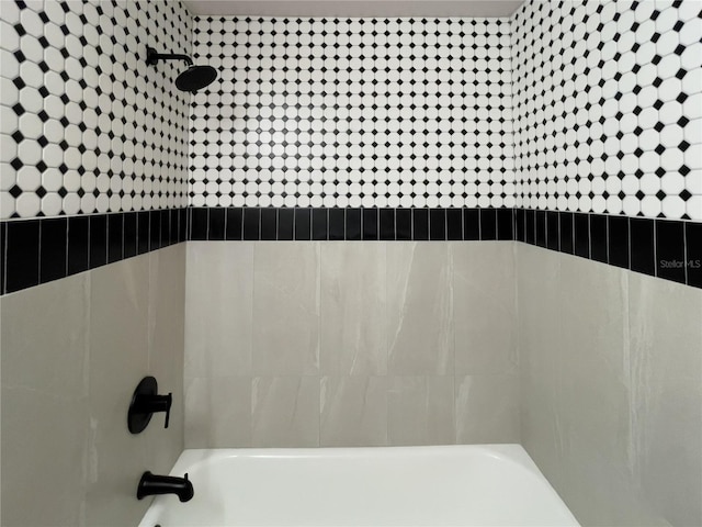 interior details featuring shower / tub combination