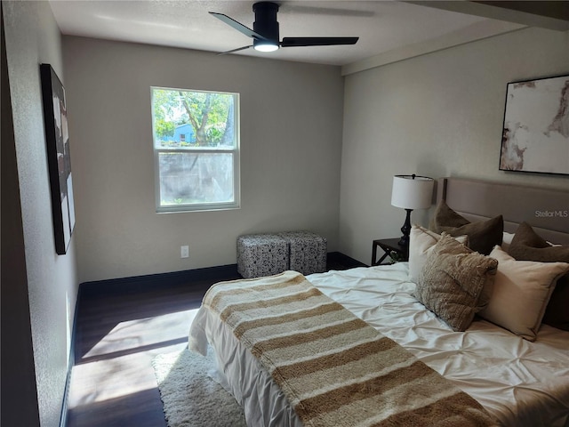 bedroom featuring ceiling fan and wood finished floors