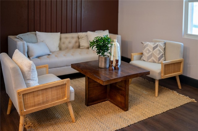 living area with wood finished floors and baseboards