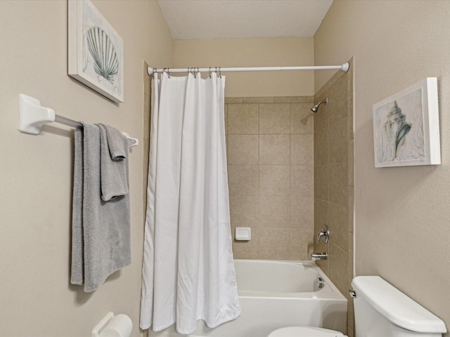 full bathroom featuring toilet and shower / bath combination with curtain