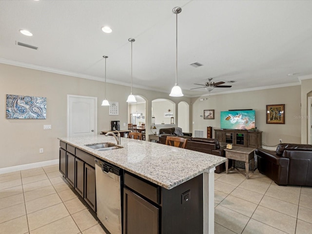 kitchen featuring visible vents, a sink, open floor plan, arched walkways, and dishwasher