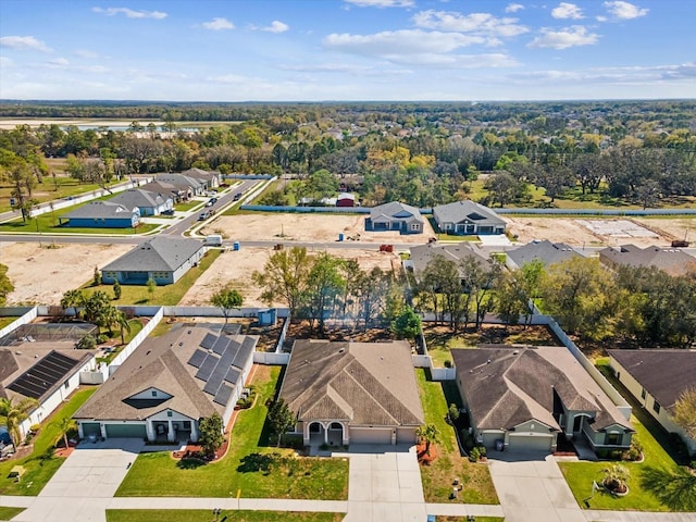 birds eye view of property with a residential view