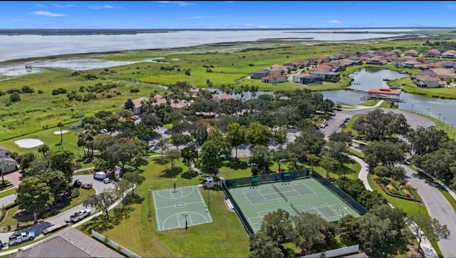 drone / aerial view featuring a water view and a residential view