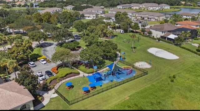 bird's eye view featuring a residential view and a water view