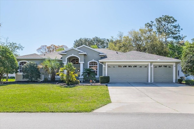 ranch-style house with stucco siding, a front lawn, concrete driveway, a shingled roof, and a garage