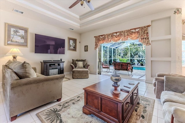 living area featuring light tile patterned floors, a ceiling fan, and visible vents