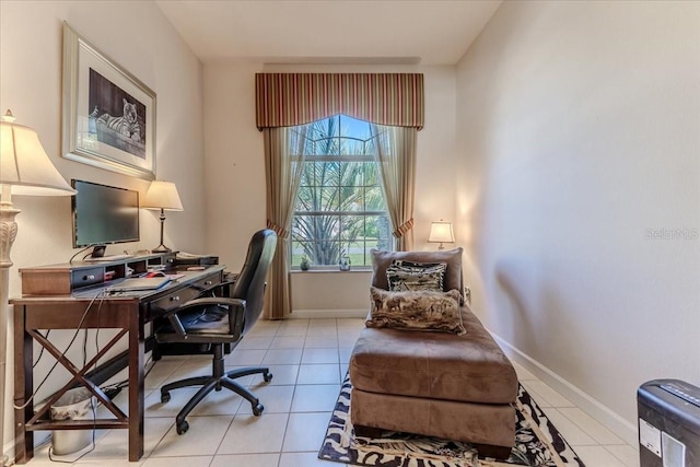 office area featuring light tile patterned floors and baseboards