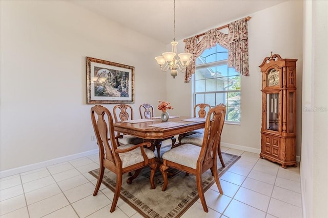 dining room with a notable chandelier, baseboards, and light tile patterned floors