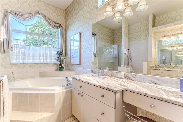 full bath with vanity, a bath, wallpapered walls, a shower stall, and a notable chandelier