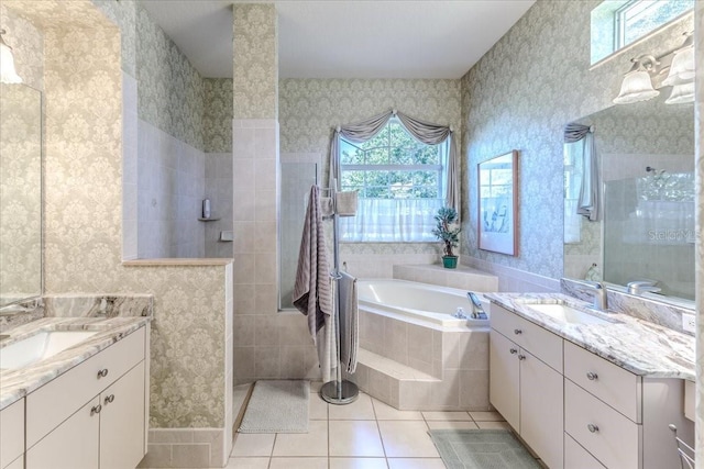 full bathroom featuring a sink, a walk in shower, tile patterned flooring, and wallpapered walls