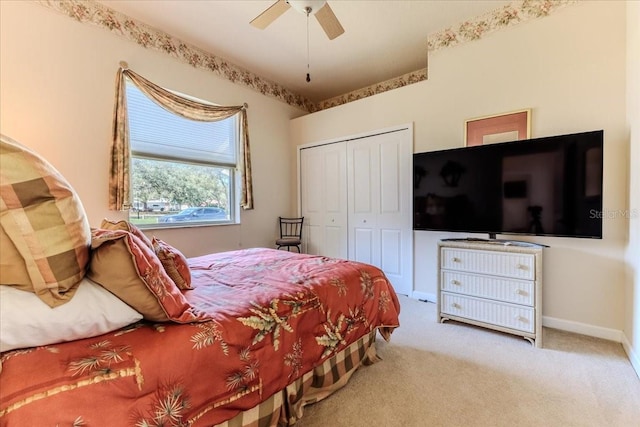 bedroom with a closet, carpet floors, baseboards, and a ceiling fan