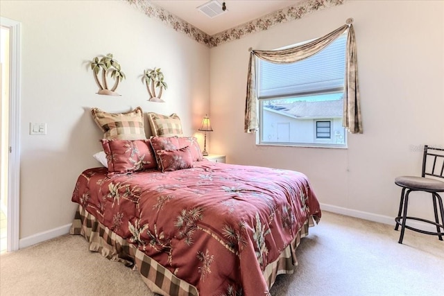 carpeted bedroom with baseboards and visible vents