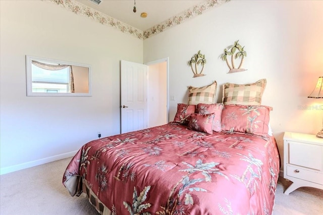 bedroom featuring carpet and baseboards