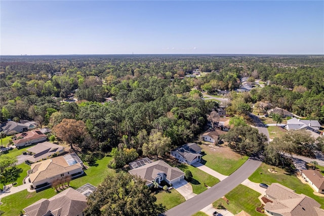 bird's eye view with a forest view and a residential view