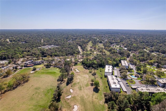 birds eye view of property with a forest view