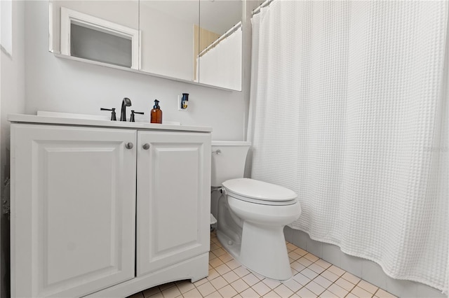 full bathroom with vanity, tile patterned floors, toilet, and a shower with curtain