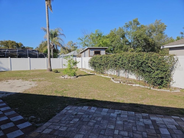 view of yard with a fenced backyard