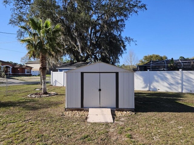 view of shed featuring a fenced backyard