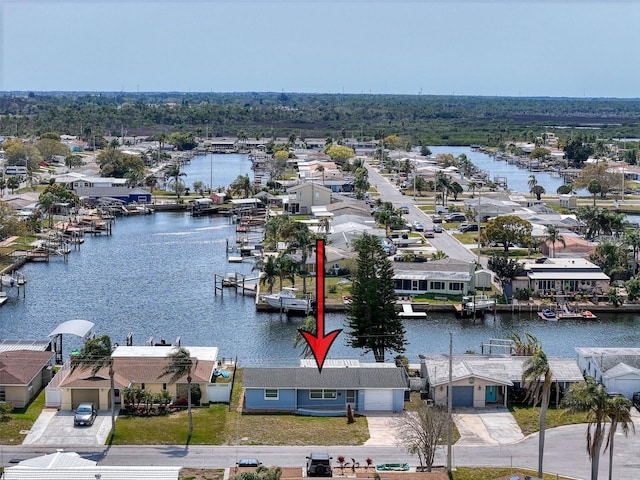 drone / aerial view with a residential view and a water view