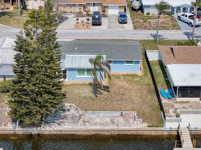 aerial view with a residential view and a water view