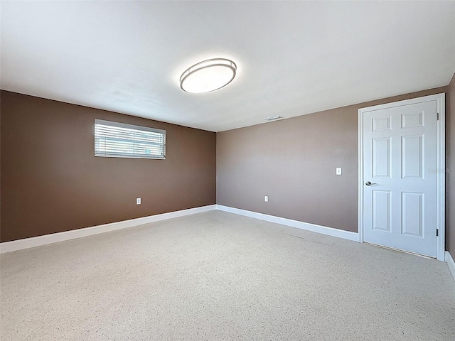 empty room with visible vents and baseboards