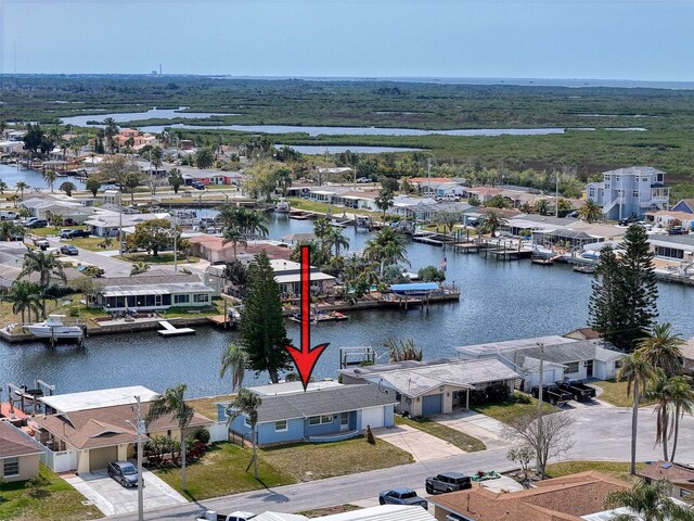 birds eye view of property featuring a residential view and a water view