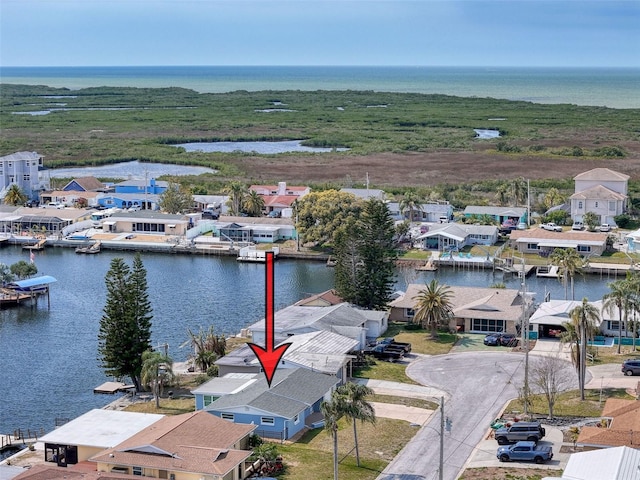 aerial view featuring a residential view and a water view