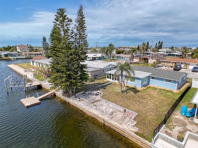 bird's eye view with a residential view and a water view