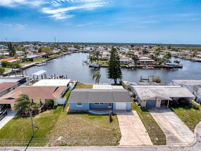 drone / aerial view with a residential view and a water view