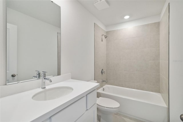 bathroom featuring vanity, shower / bathing tub combination, and toilet