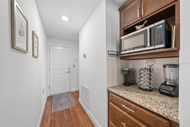 16386 Heron Hills Dr, Spring Hill, FL 34610 - corridor with recessed lighting, wood finished floors, visible vents, and baseboards