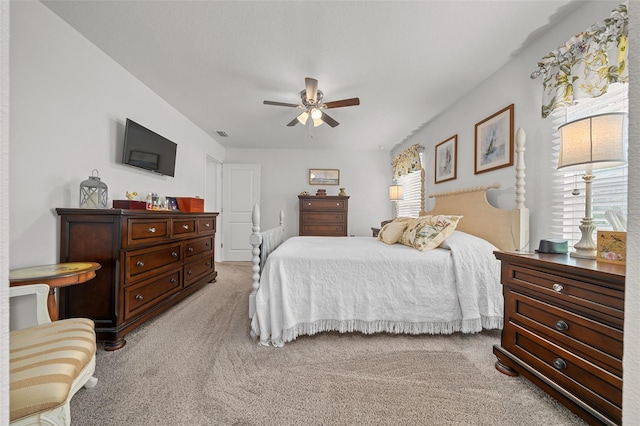 16386 Heron Hills Dr, Spring Hill, FL 34610 - bedroom featuring light carpet, a ceiling fan, and visible vents
