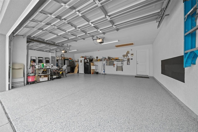 16386 Heron Hills Dr, Spring Hill, FL 34610 - garage featuring a garage door opener and a textured wall