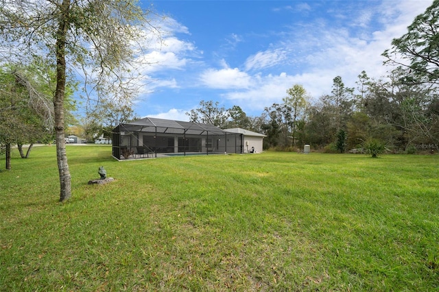 16386 Heron Hills Dr, Spring Hill, FL 34610 - view of yard featuring glass enclosure