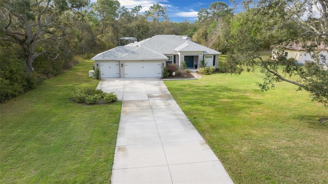 16386 Heron Hills Dr, Spring Hill, FL 34610 - view of front facade featuring an attached garage, roof with shingles, a front yard, and concrete driveway