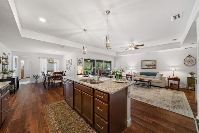 16386 Heron Hills Dr, Spring Hill, FL 34610 - kitchen with dishwasher, a tray ceiling, and a sink