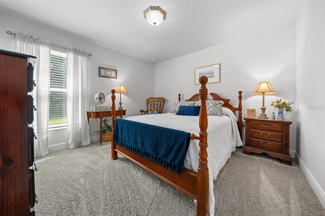 16386 Heron Hills Dr, Spring Hill, FL 34610 - carpeted bedroom featuring baseboards