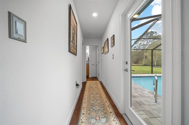 16386 Heron Hills Dr, Spring Hill, FL 34610 - hallway featuring baseboards, wood finished floors, and recessed lighting